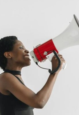 A woman shouts into a megaphone