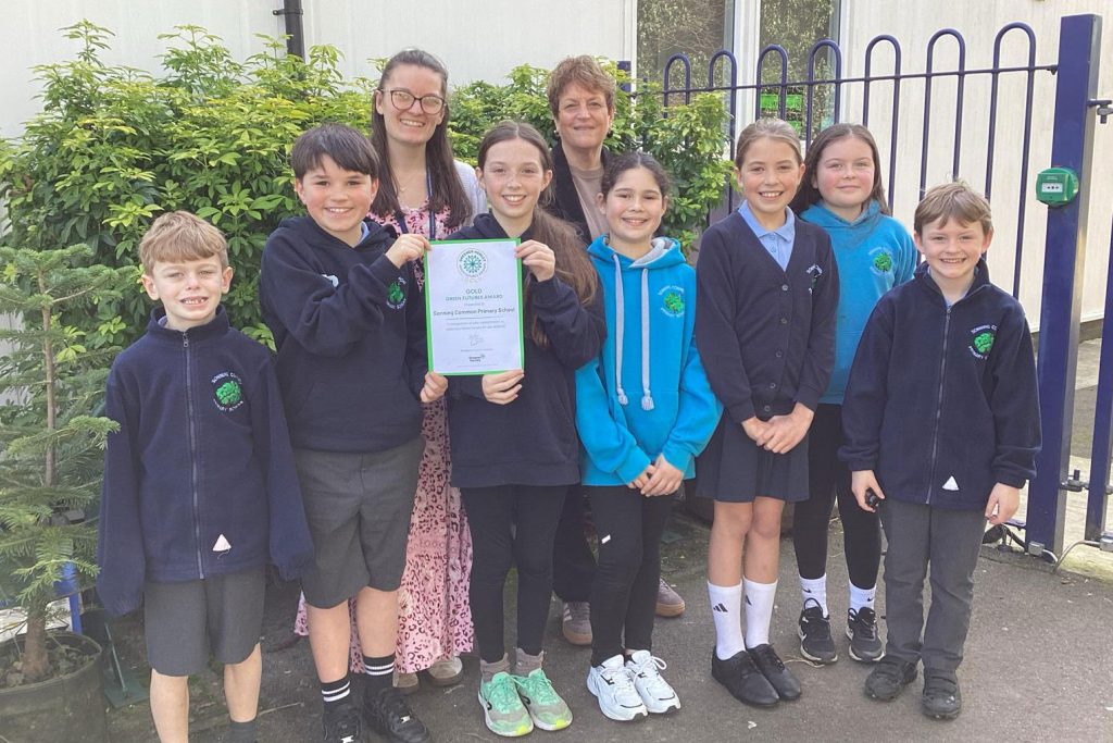 Children from Sonning Common Primary School proudly displaying their Gold