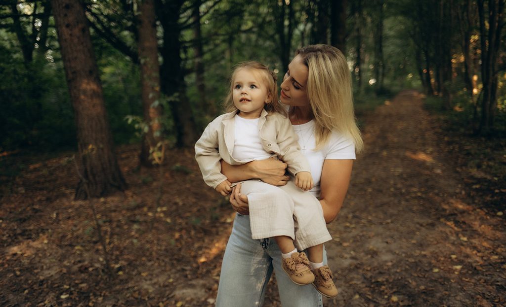 mother and child in the woods