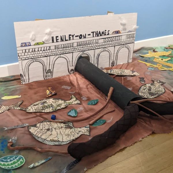 a mixed media installation showing pollution pouring into the river Thames