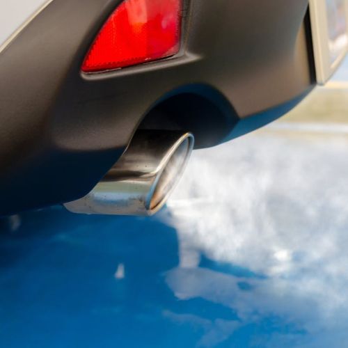 A close up of a car exhaust showing pollution