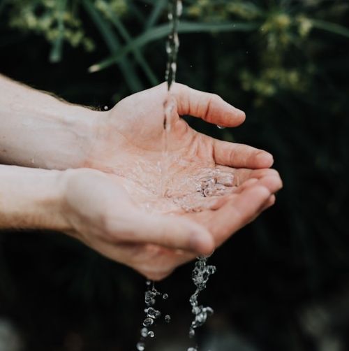 water falling into cupped hands